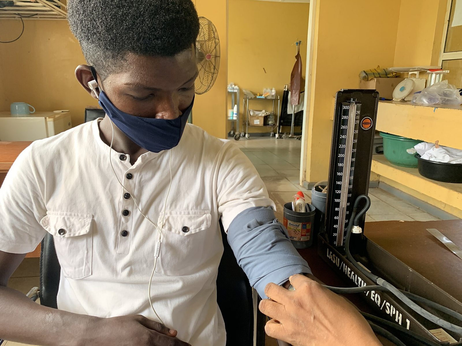 A man has his blood pressure measured.