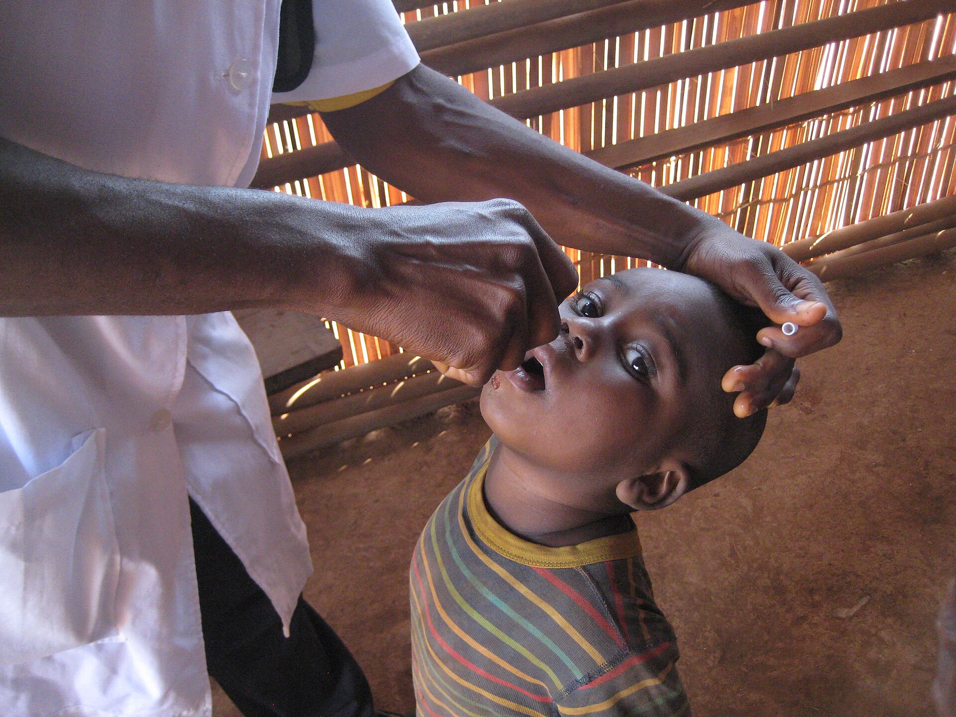 A child receives an oral vaccine during an immunisation campaign in Cameroon in 2015.