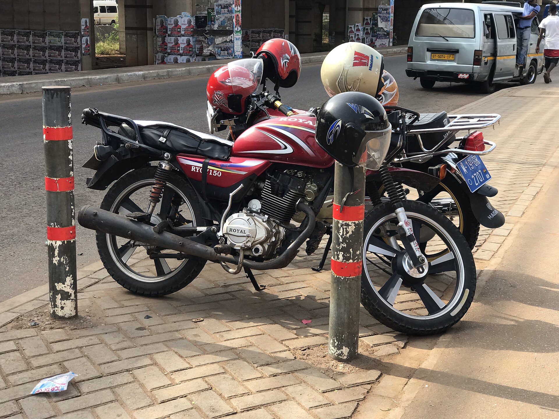 Motorcycle taxis parked in Madina, Accra, in 2019.