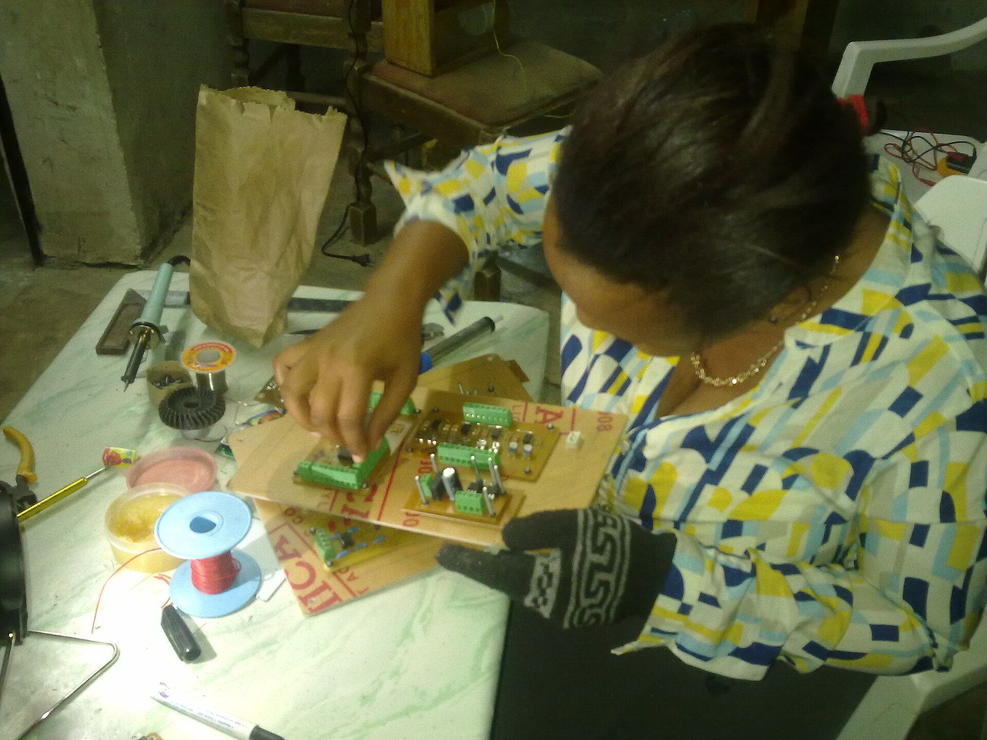 A technician repairs electronics in Tanzania in 2017.